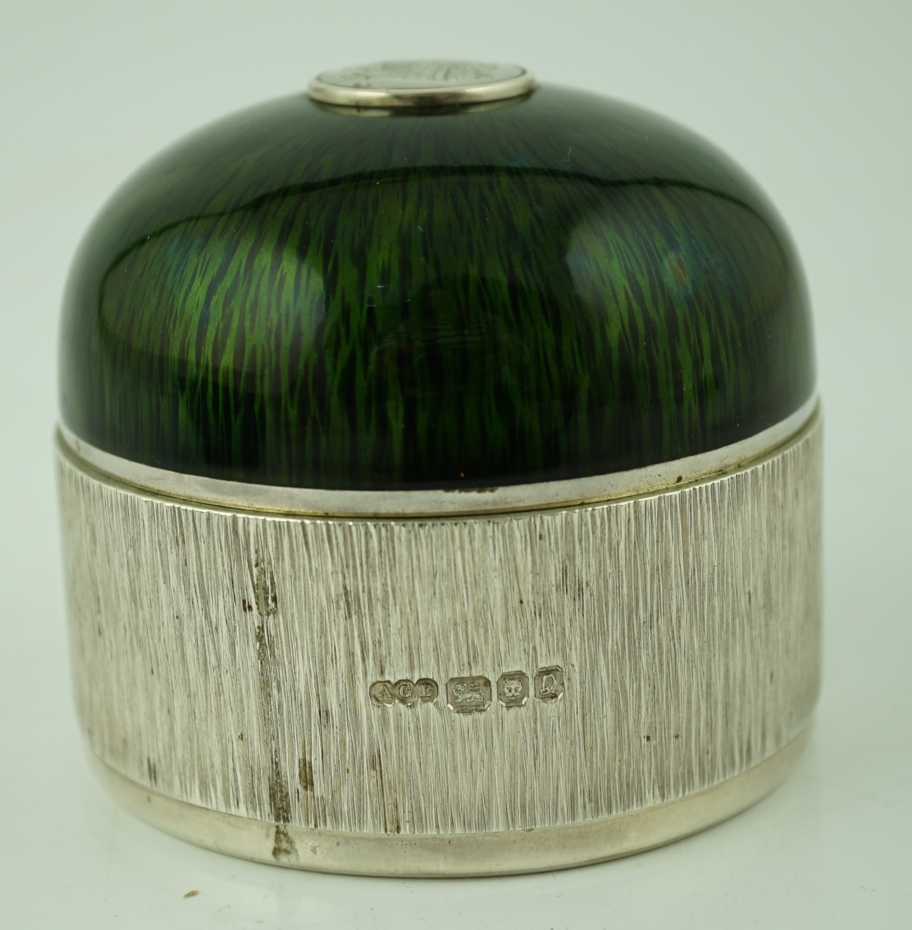 An Elizabeth II textured silver and green enamelled circular box and cover by Adrian Gerald Benney